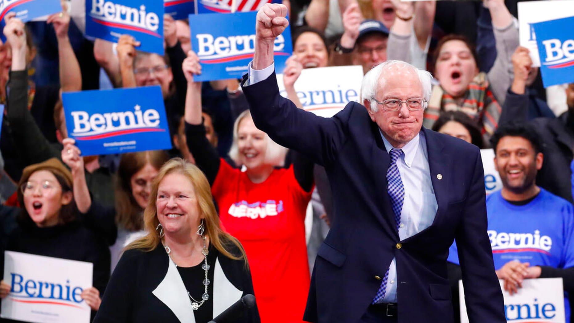 Democratic presidential candidate Sen. Bernie Sanders, I-Vt., with his wife Jane O'Meara Sanders, arrives to speak to supporters at a primary night election rally in Manchester, N.H., Tuesday, Feb. 11, 2020. (AP Photo/Pablo Martinez Monsivais)