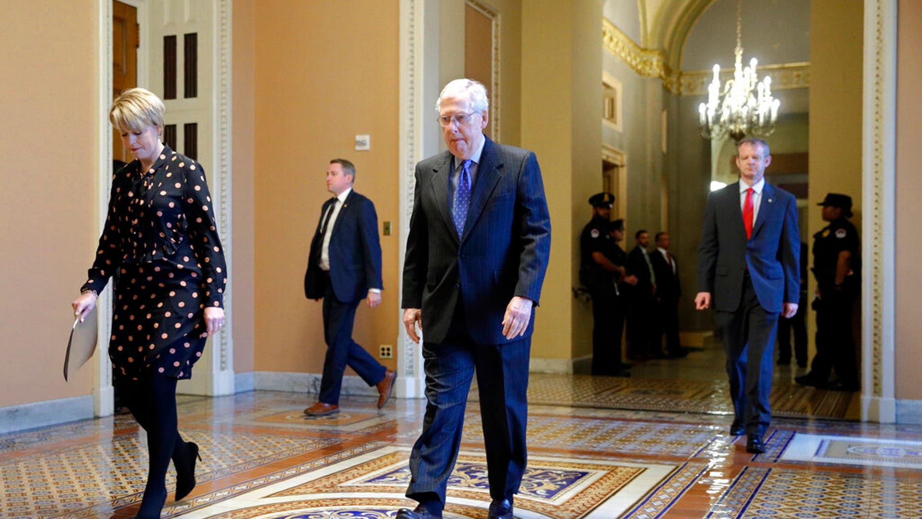 Senate Majority Leader Mitch McConnell of Ky. walks to the Senate chamber on Capitol Hill in Washington, Tuesday, March 24, 2020. (AP Photo/Patrick Semansky)
