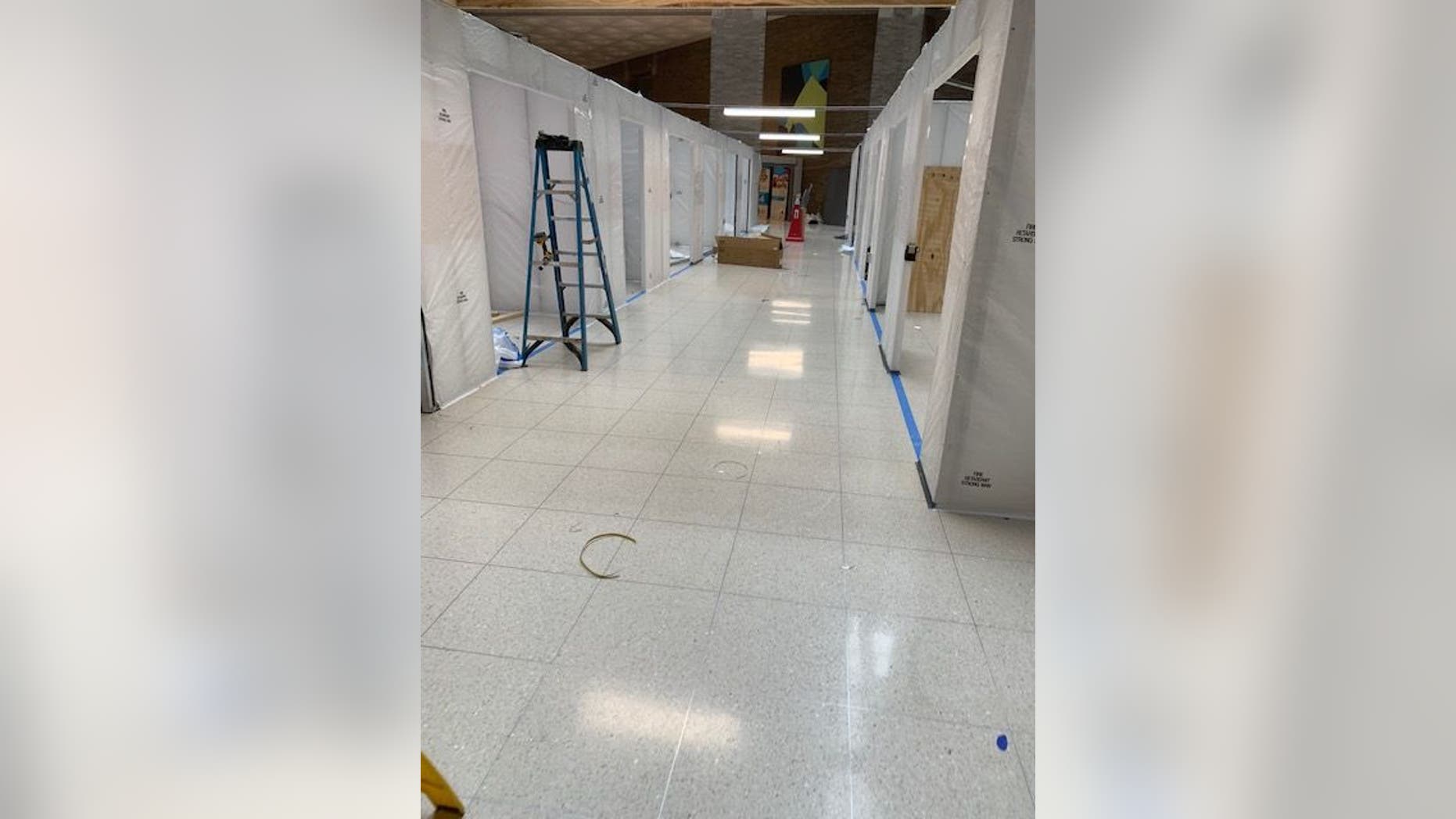 In the lobby of The Mount Sinai Hospital on Manhattan's Upper East Side (pictured above), officials are building additional rooms to handle an overflow of COVID-19 patients.