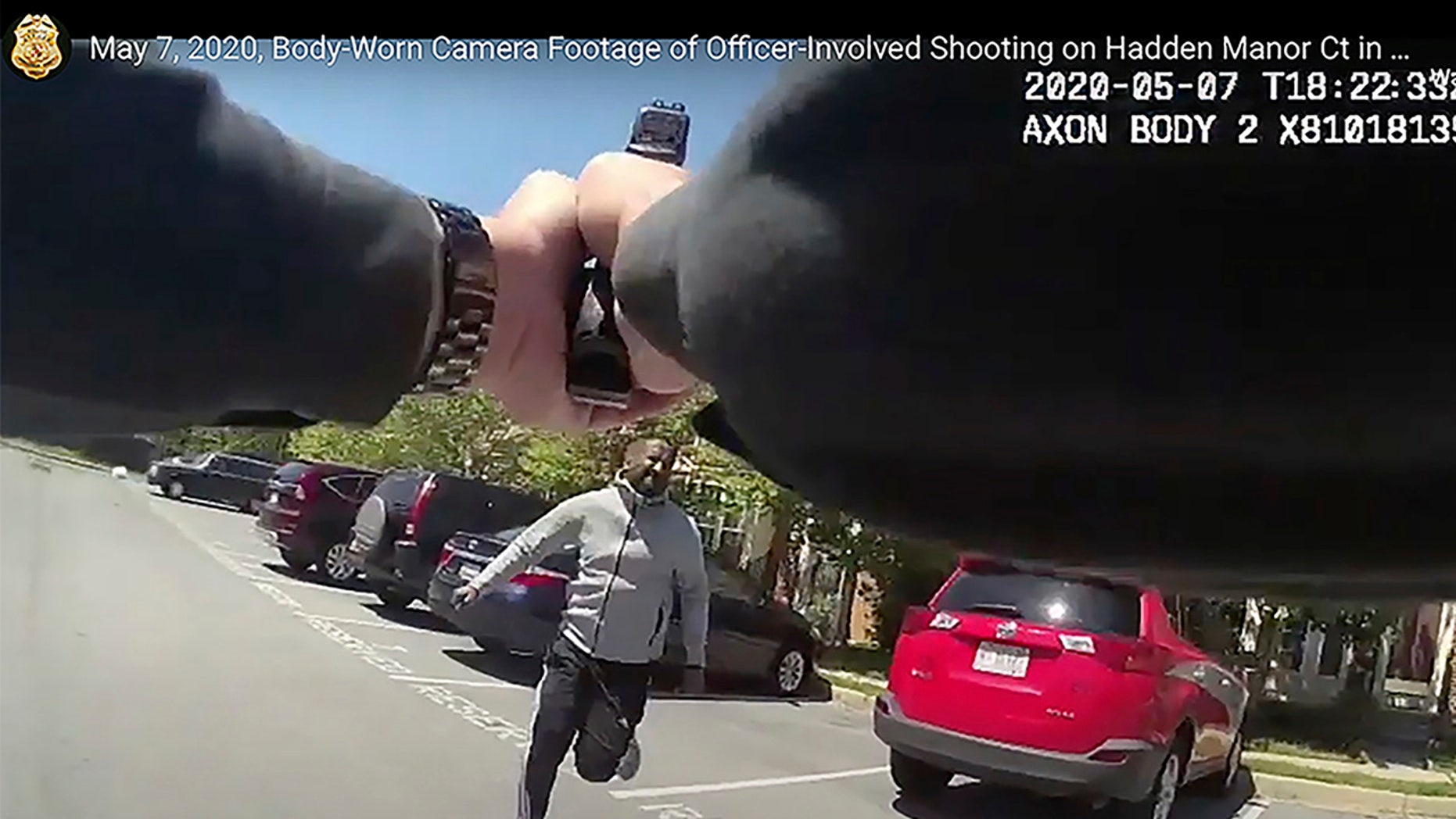 In this frame grab from body camera video provided by the Montgomery County Department of Police, taken Thursday, May 7, 2020, Montgomery County Police Sgt. David Cohen aims and shoots Finan H. Berhe, as Berhe, holding a knife, charges at Cohen, after the officer had ordered Berhe to drop the knife and get down on the ground, in the White Oak area of Montgomery County, Md. Berhe died at a hospital, police said. No officers were injured. (Montgomery County Department of Police via AP)
