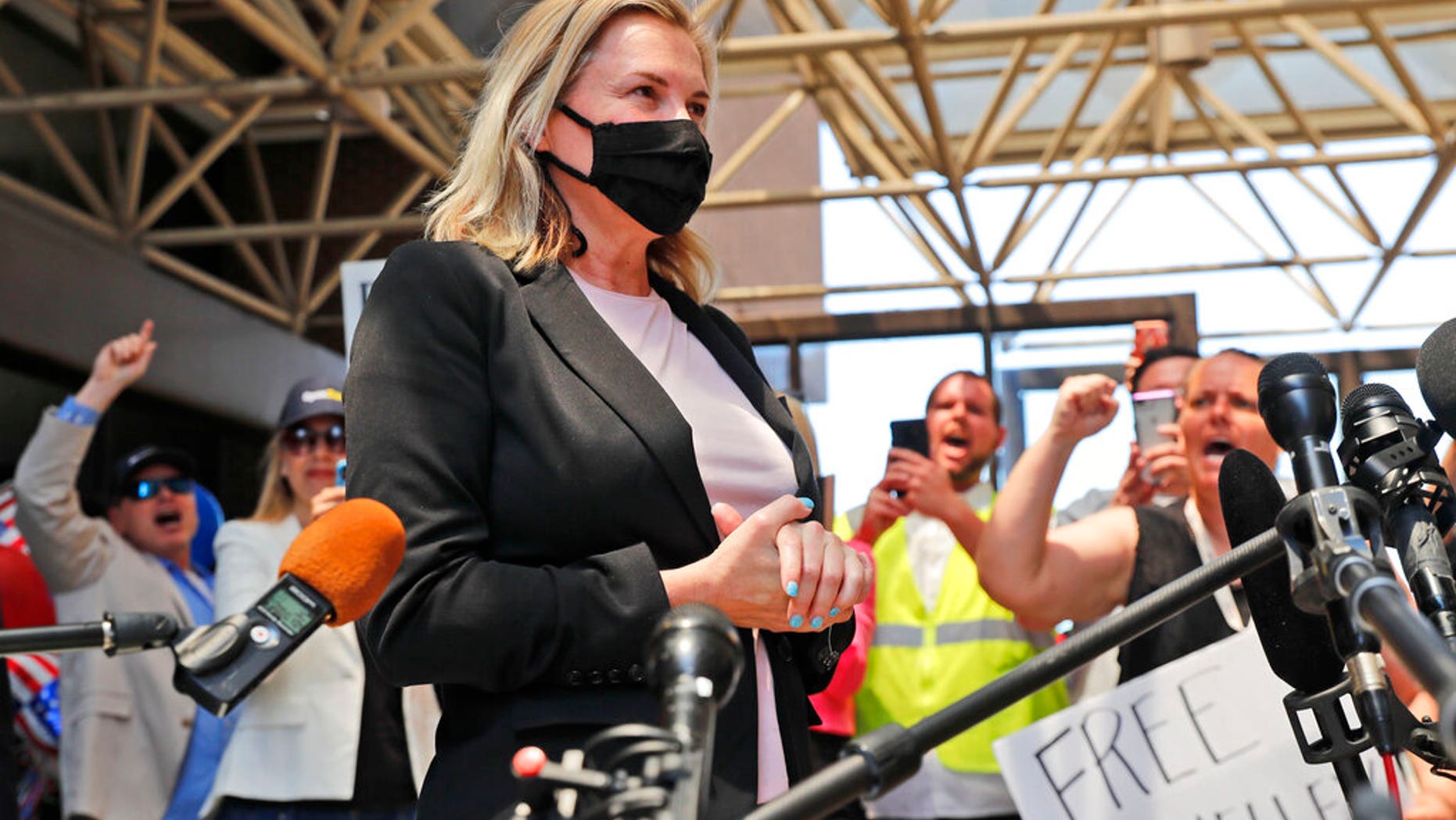 Salon owner Shelley Luther begins to speak to the media after she was released from jail in Dallas, Thursday, May 7, 2020. (AP Photo/LM Otero)