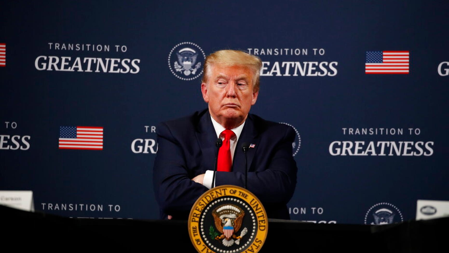 President Donald Trump listens during a listening session with African-American leaders at Ford's Rawsonville Components Plant that has been converted to making personal protection and medical equipment. (AP Photo/Alex Brandon)