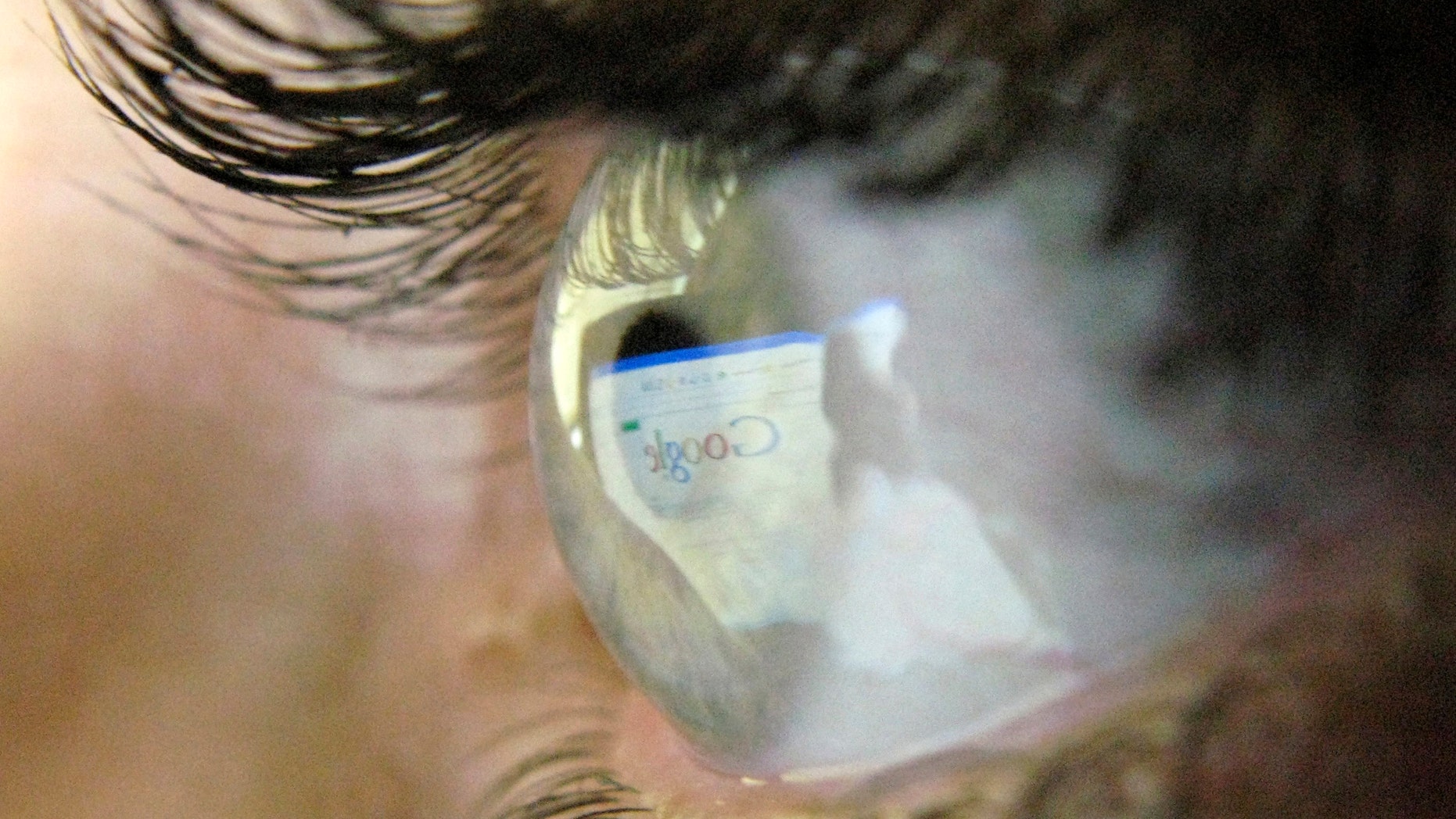 A Google search page is reflected in the eye of a computer user in Leicester, central England, July 20, 2007 - file photo.