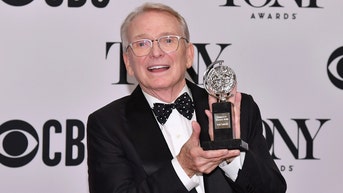 Mackie holding award - Fox News