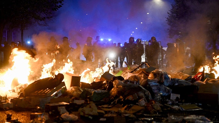 Trump demands France shut down its borders as masked rioters burn landmarks, loo