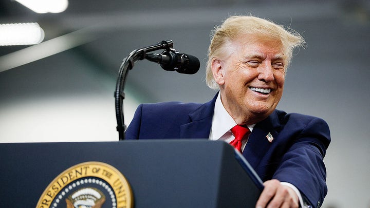 looking over, smiling - Fox News