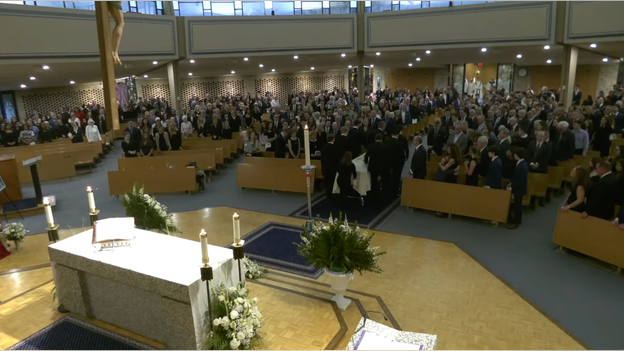 Casket removed from church as solemn funeral mass concludes