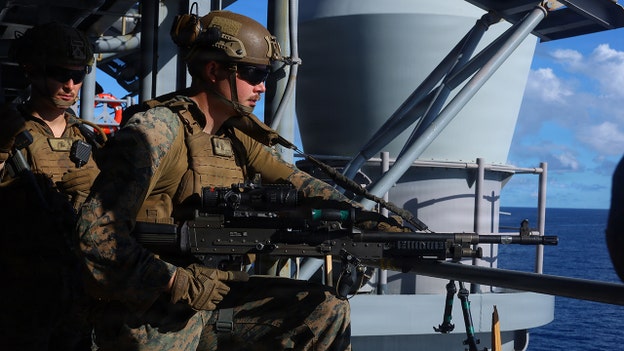 USS Tripoli arrives with Marines as US surges forces to Middle East