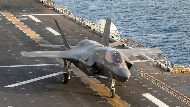 CENTCOM photo shows US jet launching from USS Tripoli after Trump vows forces stay 'hangin' around'