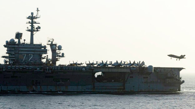Photo shows US aircraft carrier conducting blockade of Iranian ports
