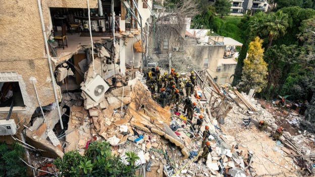 Israeli rescuers pull 4 bodies from rubble after Iranian airstrike hits Haifa, IDF says