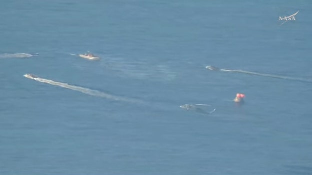 Recovery forces seen approaching Artemis II after splashdown