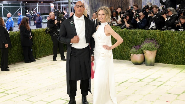 Dwayne 'The Rock' Johnson walks the red carpet with his wife