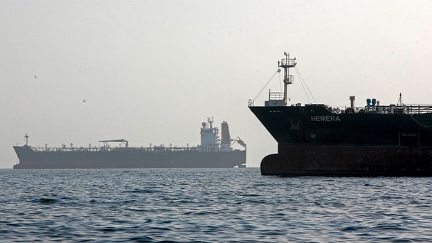 Iran claims dozens of ships coordinating passage through Strait of Hormuz as firm undercuts figure