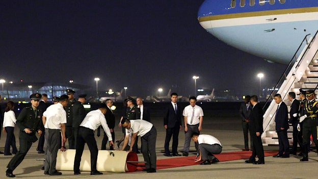 Trump's Air Force One delegation touches down in Beijing at 7:51 am ET