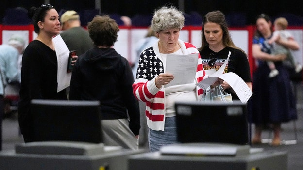 Photos show voters heading to the polls in Maine