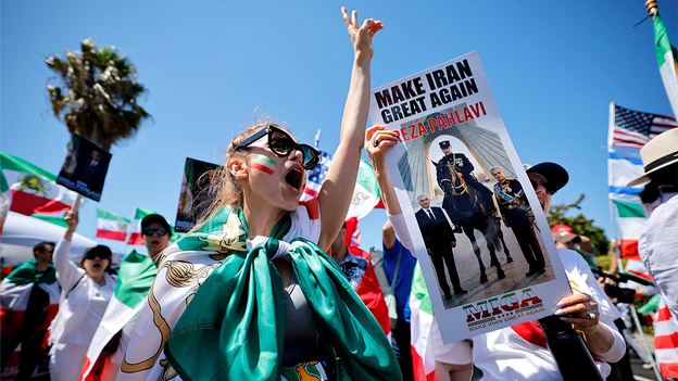 Iranian Americans wave protest flags at World Cup as Iran's team kicks off opener