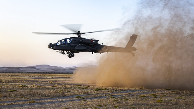 New photo shows Apache attack helicopter designed to support recon missions take off in Middle East