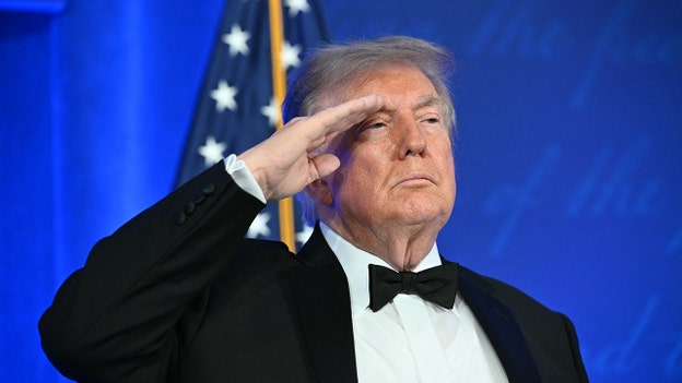 Trump takes the stage at White House Correspondents' Dinner after delayed return