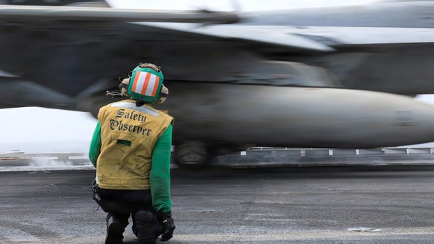 CENTCOM releases photos of fighter jets launching from aircraft carrier in Arabian Sea