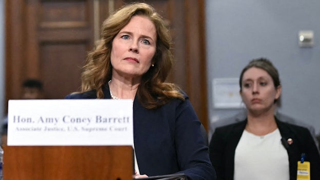 Barrett says threats forced her to explain a bulletproof vest to her 12-year-old son