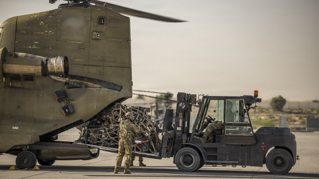 US Central Command posts photo of military helicopter delivering cargo in the Middle East