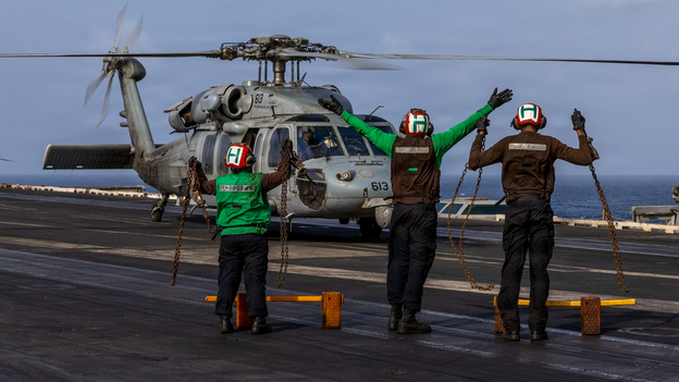 US Navy helicopter takes off from aircraft carrier deployed in Middle East: CENTCOM photos