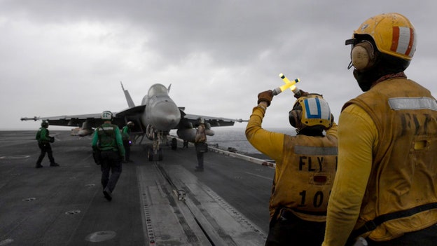 Fighter jets take off from USS George H.W. Bush in new photos released by CENTCOM