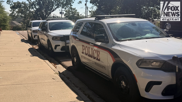 Marked cruisers line the street of Rebel Drive at Ole Miss