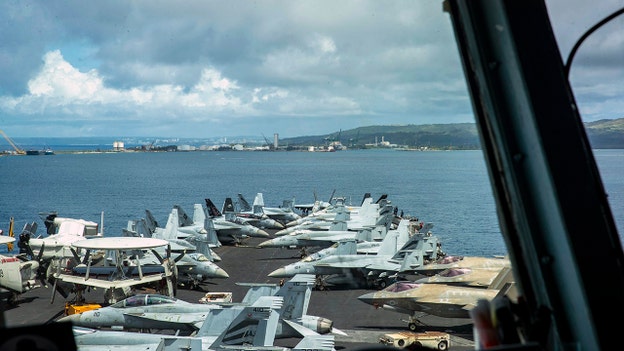 USS Abraham Lincoln makes 'first return to American soil in nine months'