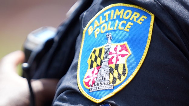Baltimore police shoot armed suspect near shopping center, election ballots caught in crossfire