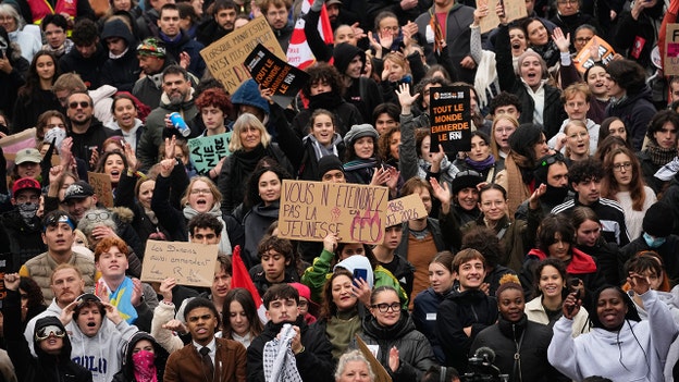 A demonstrator holds a sign reading, “You will not extinguish the fire of youth” in Orleans, France, on Saturday, Oct. 24, 2026. (Teresa Suarez/AP)