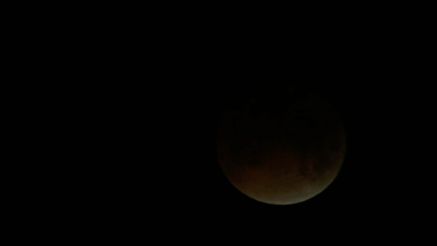 Totality begins as Moon passes through Earth's shadow