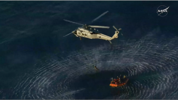 Artemis II crew hoisted into waiting Sea Hawks