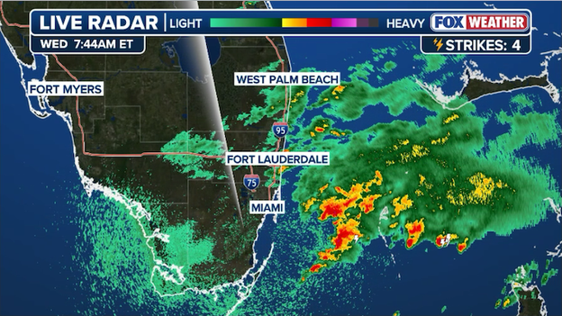Torrential downpours churn off the Miami coast with lighter rain farther north