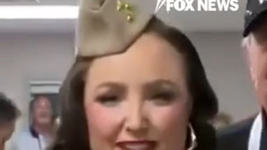 Singers honor veterans with patriotic classic during weather delay