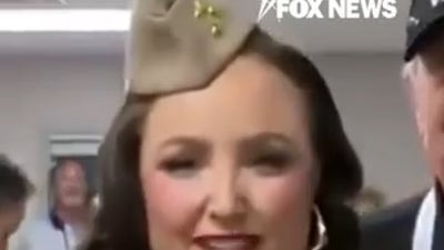 Singers honor veterans with patriotic classic during weather delay