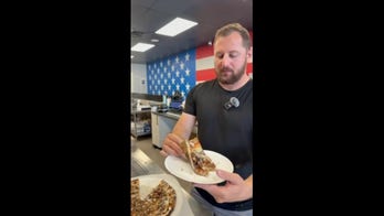 Taste test puts invasive reptile on the menu in over-the-top pizza build