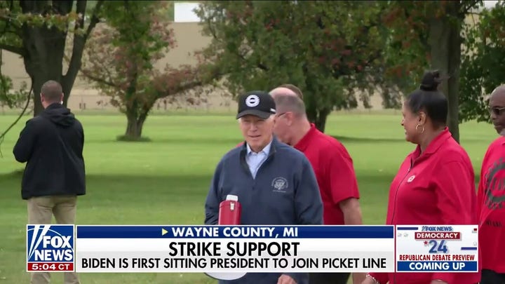 Biden walks the UAW picket line