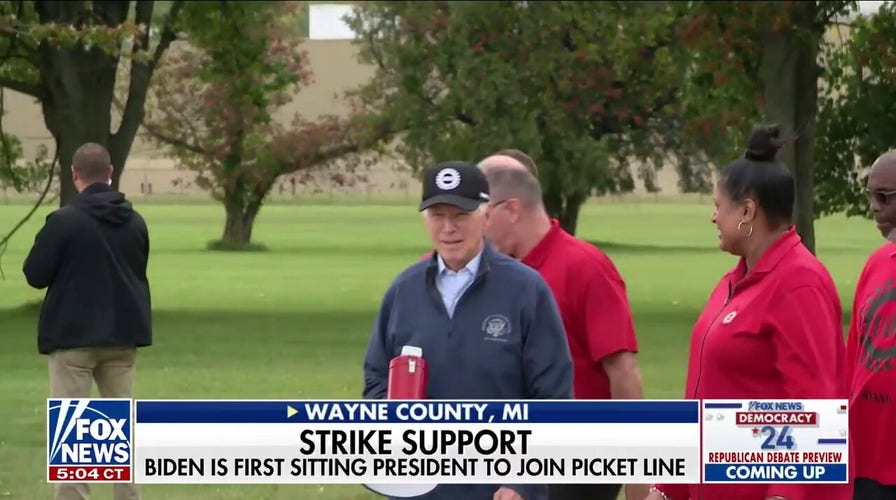 Biden walks the UAW picket line