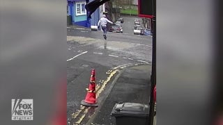 Viral video shows bar owner chasing after beer kegs as they roll down the street - Fox News