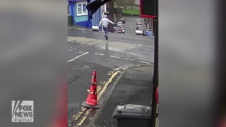Viral video shows bar owner chasing after beer kegs as they roll down the street