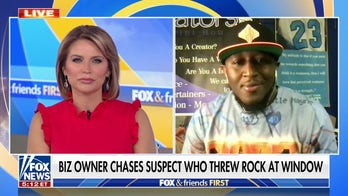 Business owner chases down suspect who threw a rock through his window