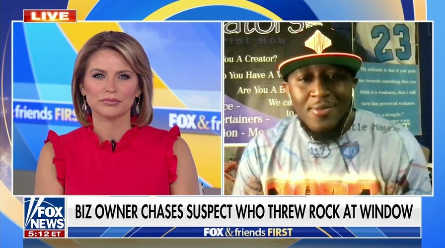Business owner chases down suspect who threw a rock through his window
