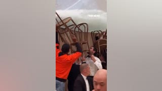 Wedding guests use chairs to stop venue from flooding - Fox News