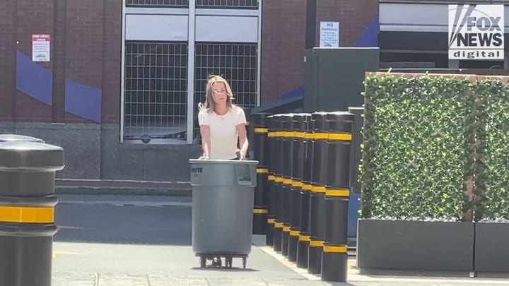 Karen Read takes out the trash behind Boston hotel