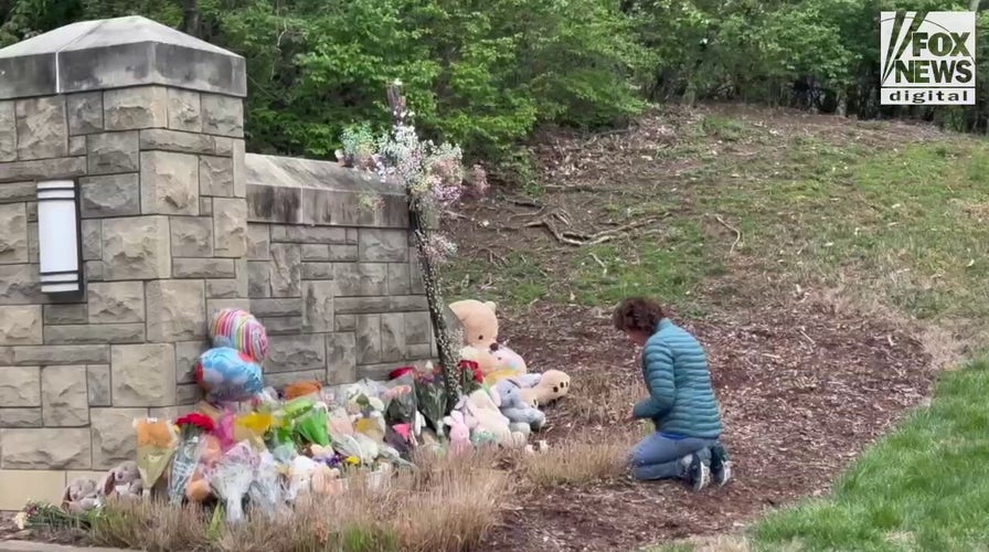 Memorials for the six victims who were killed in a mass shooting are placed outside of The Covenant School