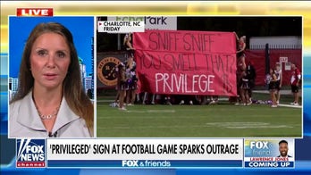 Outraged North Carolina parent calls out 'racist' banner taunting football team's White privilege