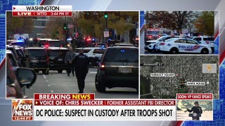 Two national Guard officers shot and in critical condition, suspect in custody