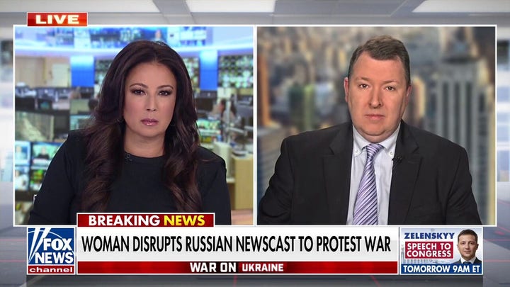 Russian state TV staffer interrupts broadcast to protest war in Ukraine